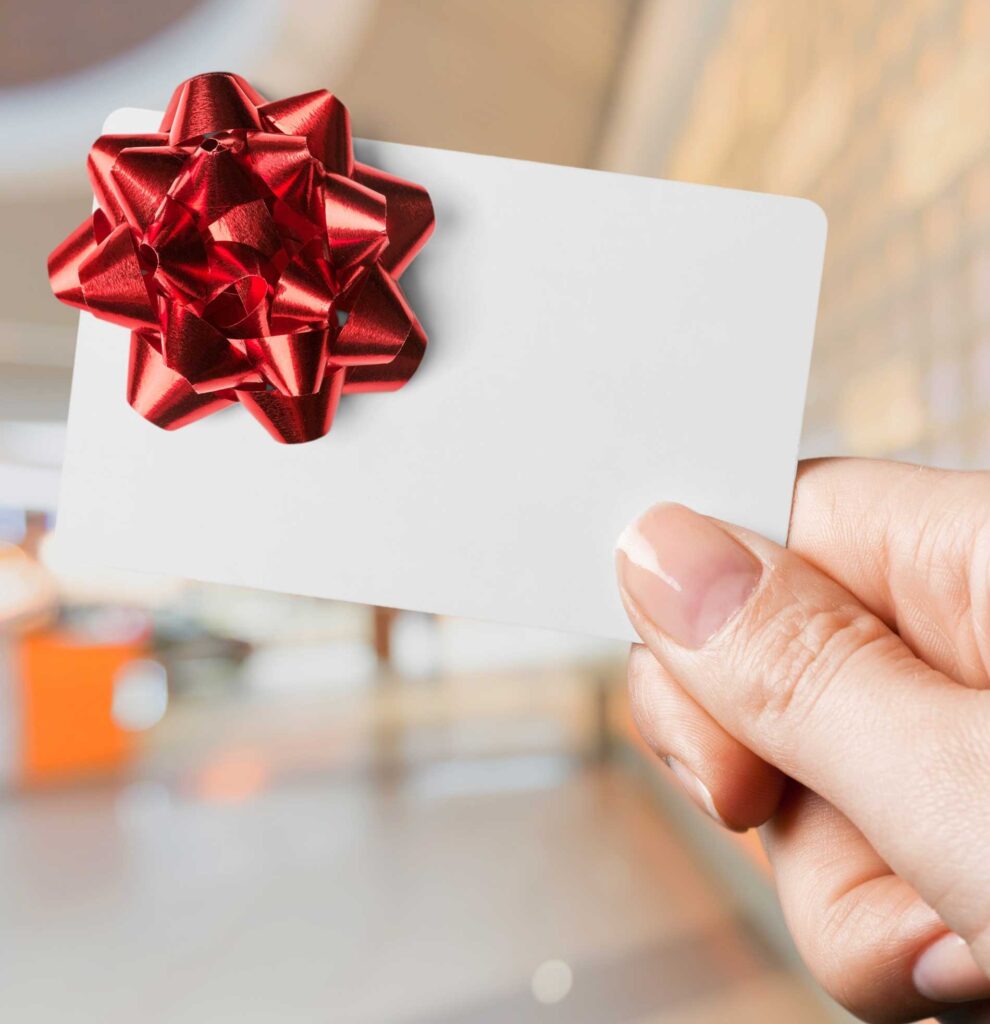 A blank giftcard with a red bow