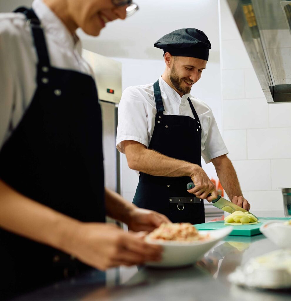 Two chefs working in a kitchen
