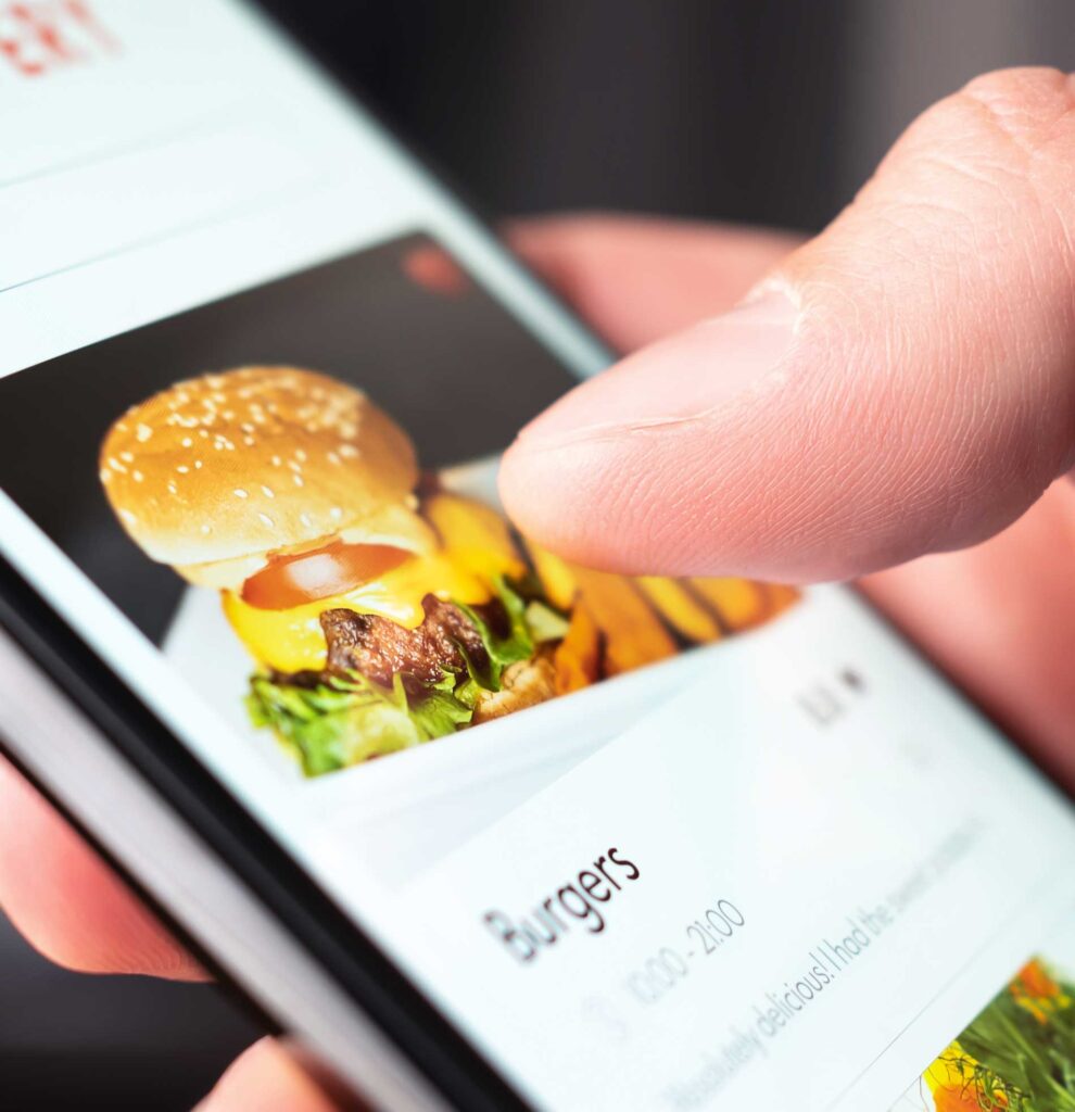 Close-up of someone ordering food on their cellphone